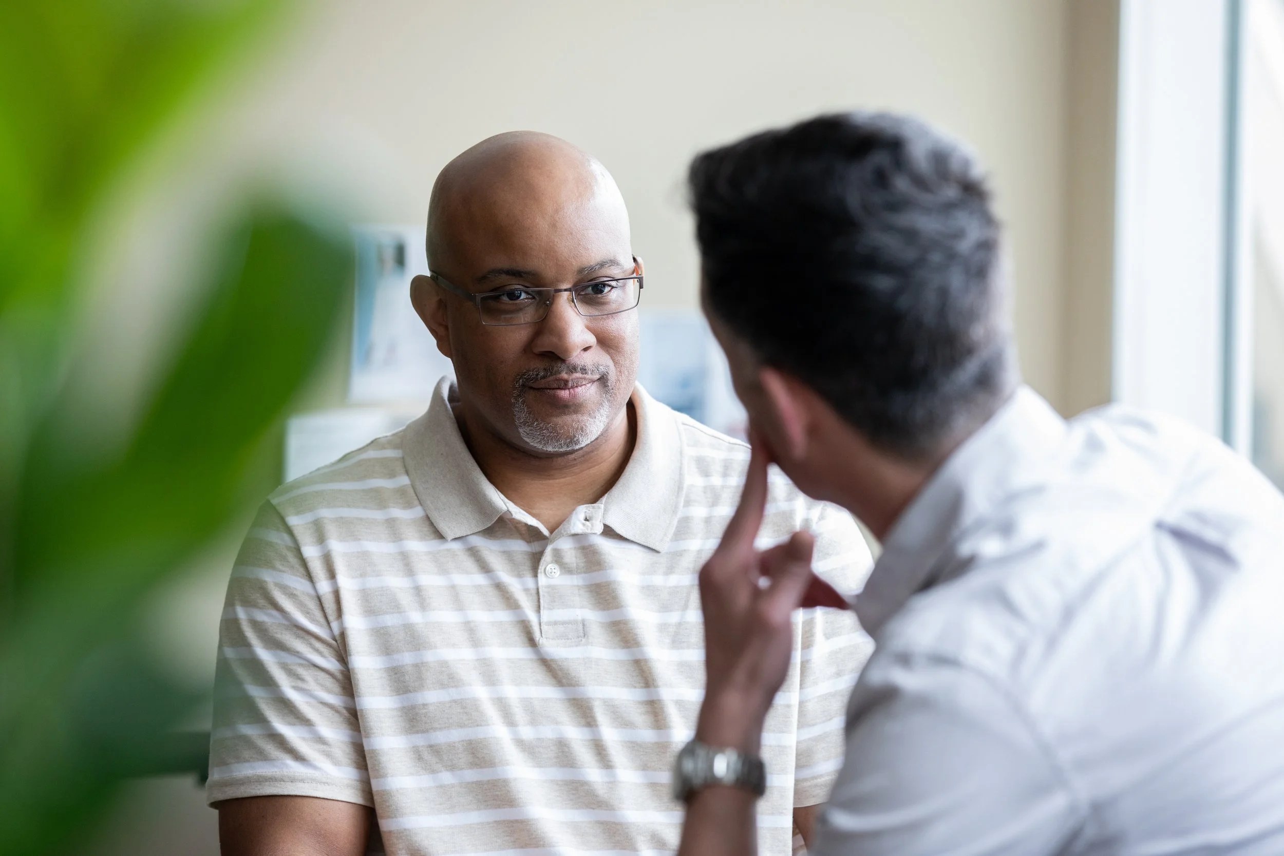 A man discussing with his doctor options for his heart health.