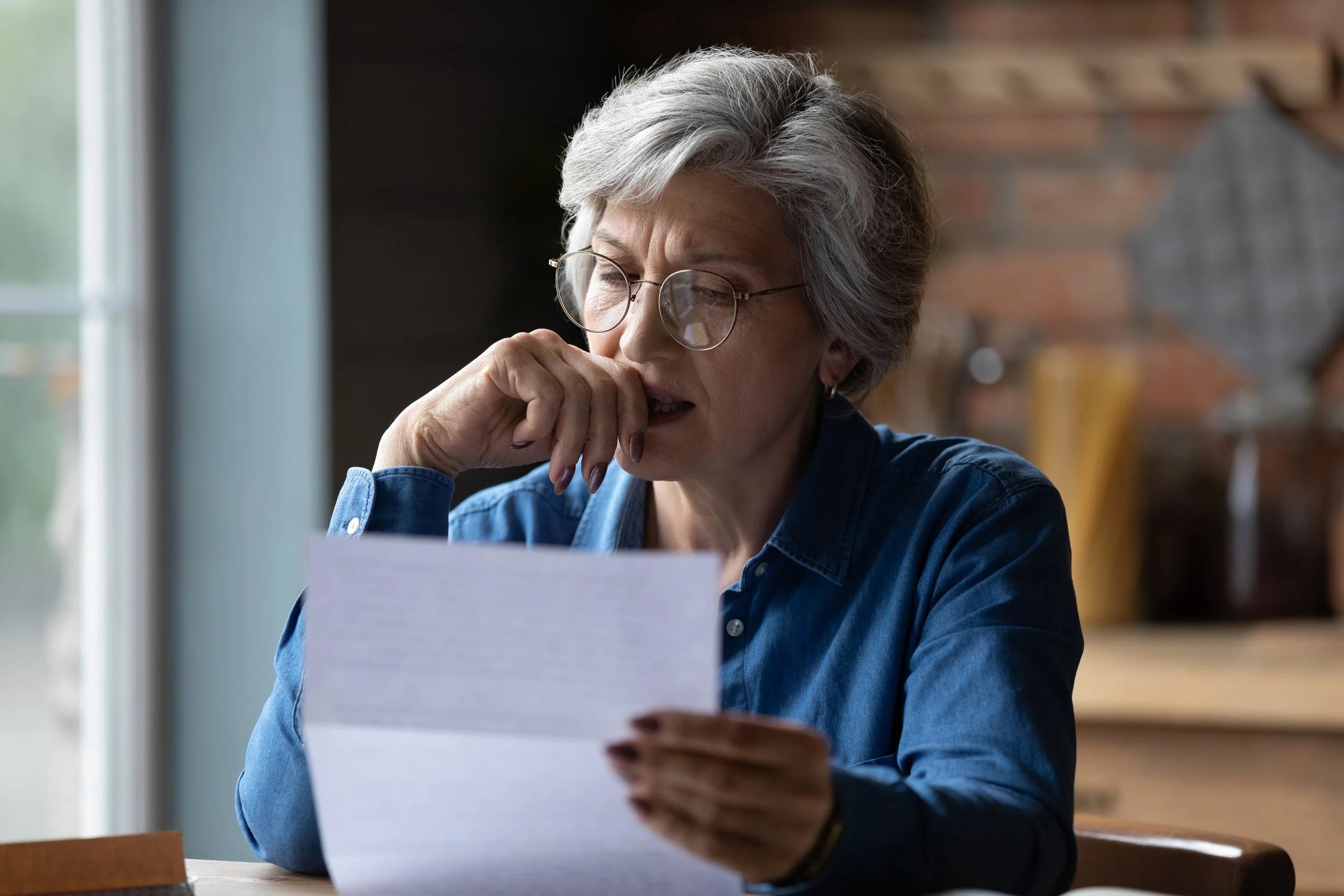 Mature woman trying to decipher her confusing lab results.